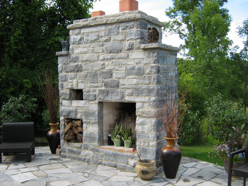 Outdoor fireplace by Colin Coveny